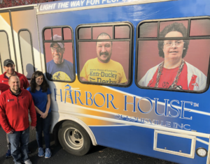 Dixie Law Group, PSC team next to Harbor House bus in Louisville, Kentucky